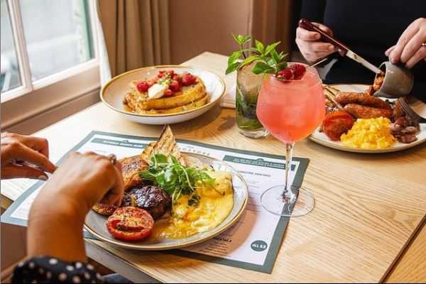 A table of delicious brunch options at The Longstore, Truro including a full english breakfast and french toast