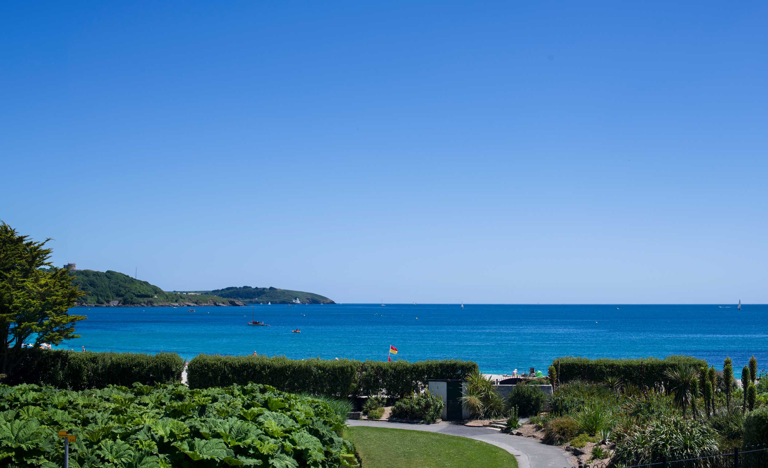 A view of the sea from Sunrise Apartment with blue skies and blue water