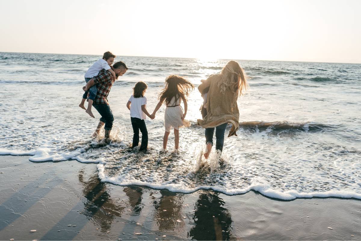 Family paddling in the sea